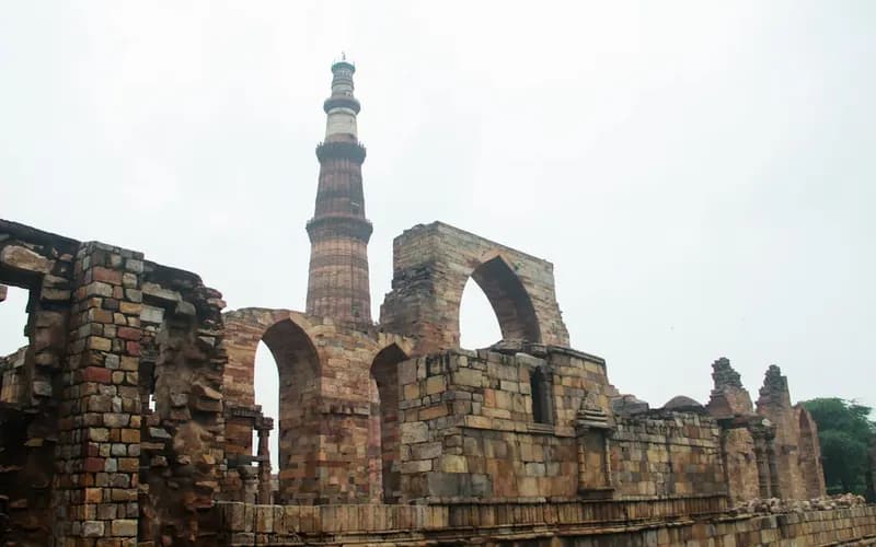 Historic Indian Islamic architecture featuring intricate domes and arches under daylight