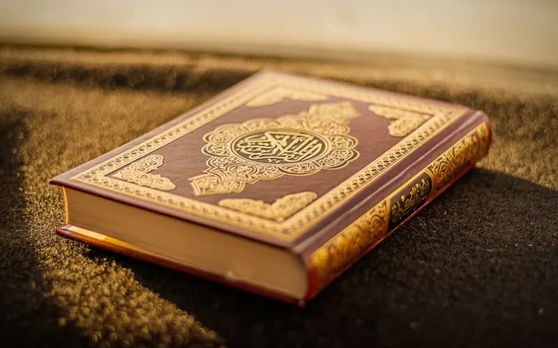 Open Quran manuscript pages symbolizing the first revelation received by Prophet Muhammad